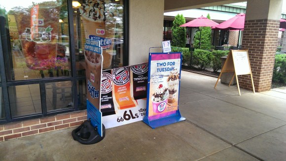 Note the upside down sign thrown behind the other standing signs.