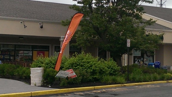 The signs below the Vonage sign are not for any business in the plaza and are repeated twenty feet away.